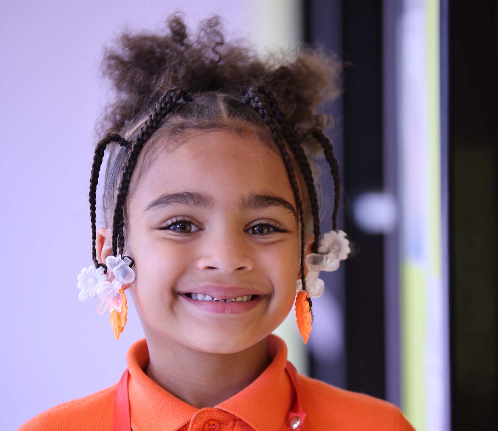HSA Lorain South student wearing headphones uses a laptop in class